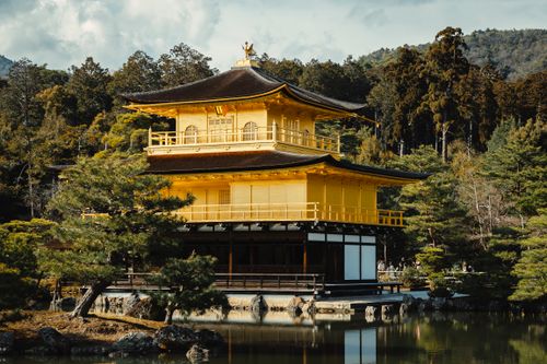 Free Golden Pavilion, Kinkaku-ji temple in Kyoto, Japan during a serene daytime setting. Stock Photo