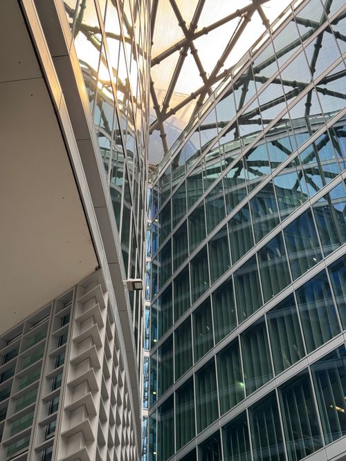Free High-rise glass skyscraper reflecting light, showcasing modern architectural style in Milan, Italy. Stock Photo
