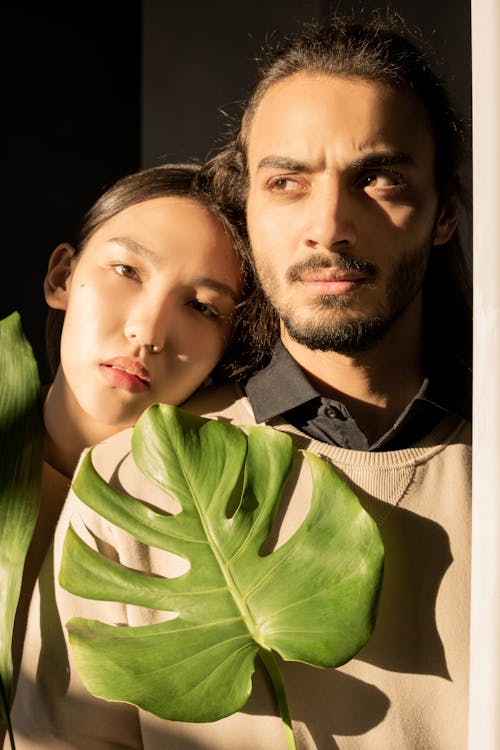 Free Couple Holding Green Leaf Stock Photo