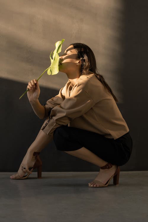 Free Woman Holding Green Leaf Stock Photo