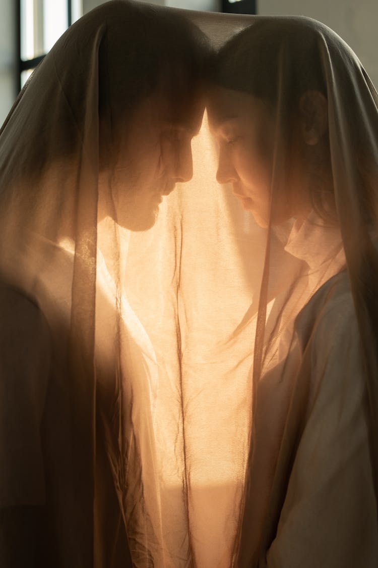 Woman And Man In Brown Sheer Fabric