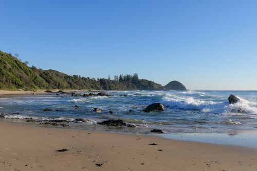 Free Tranquil morning at Shelly Beach with waves and rocky coastline in New South Wales. Stock Photo