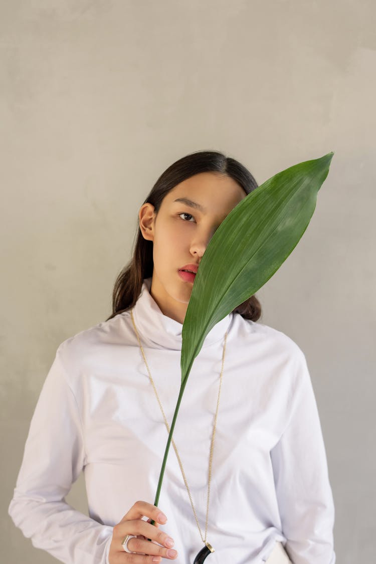 Photo Of Woman Holding Leaf