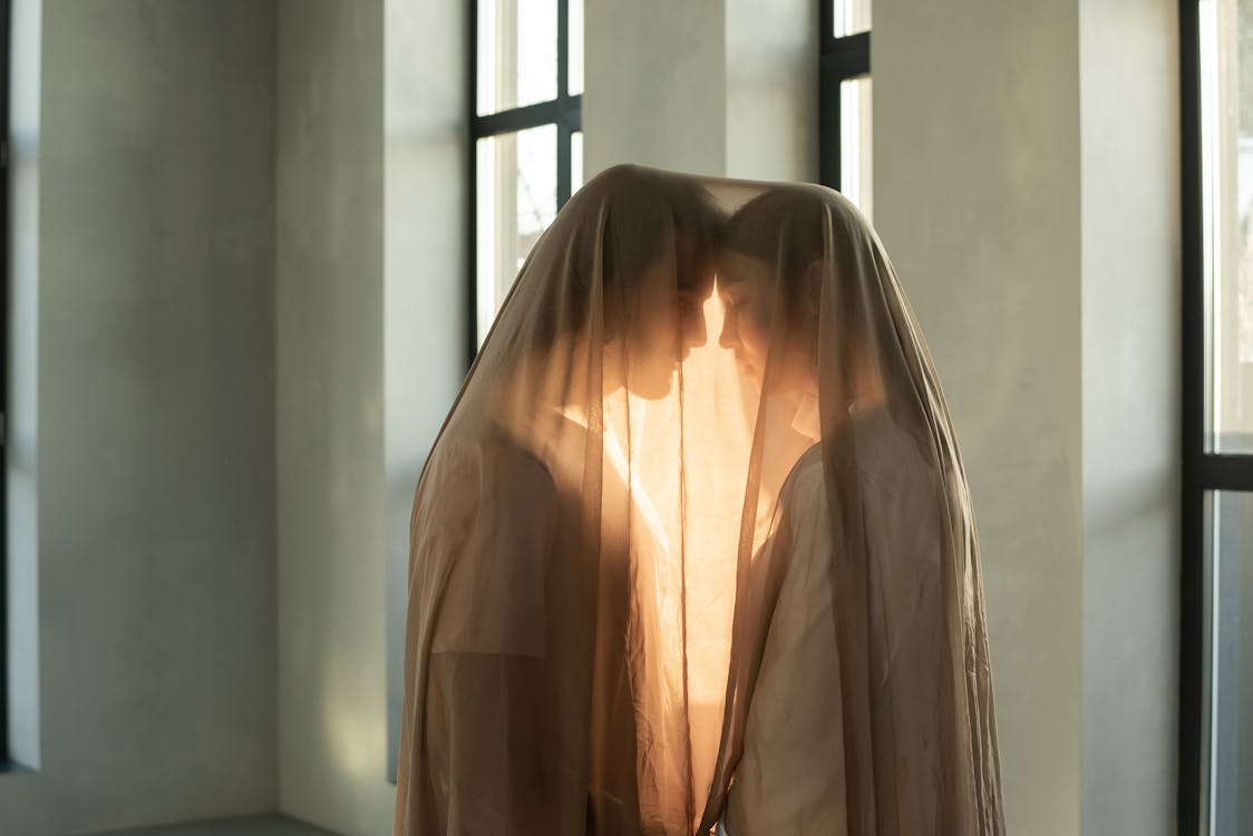 Free Couple Covered in Sheer Fabric Stock Photo