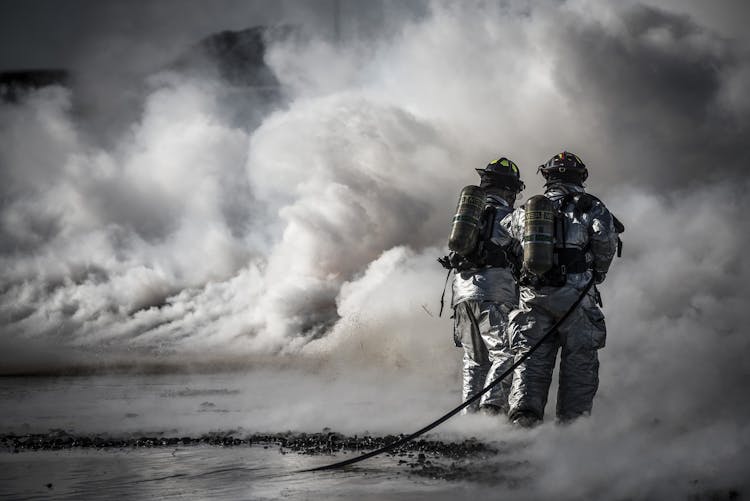 Firefighter Standing Beside Smoke