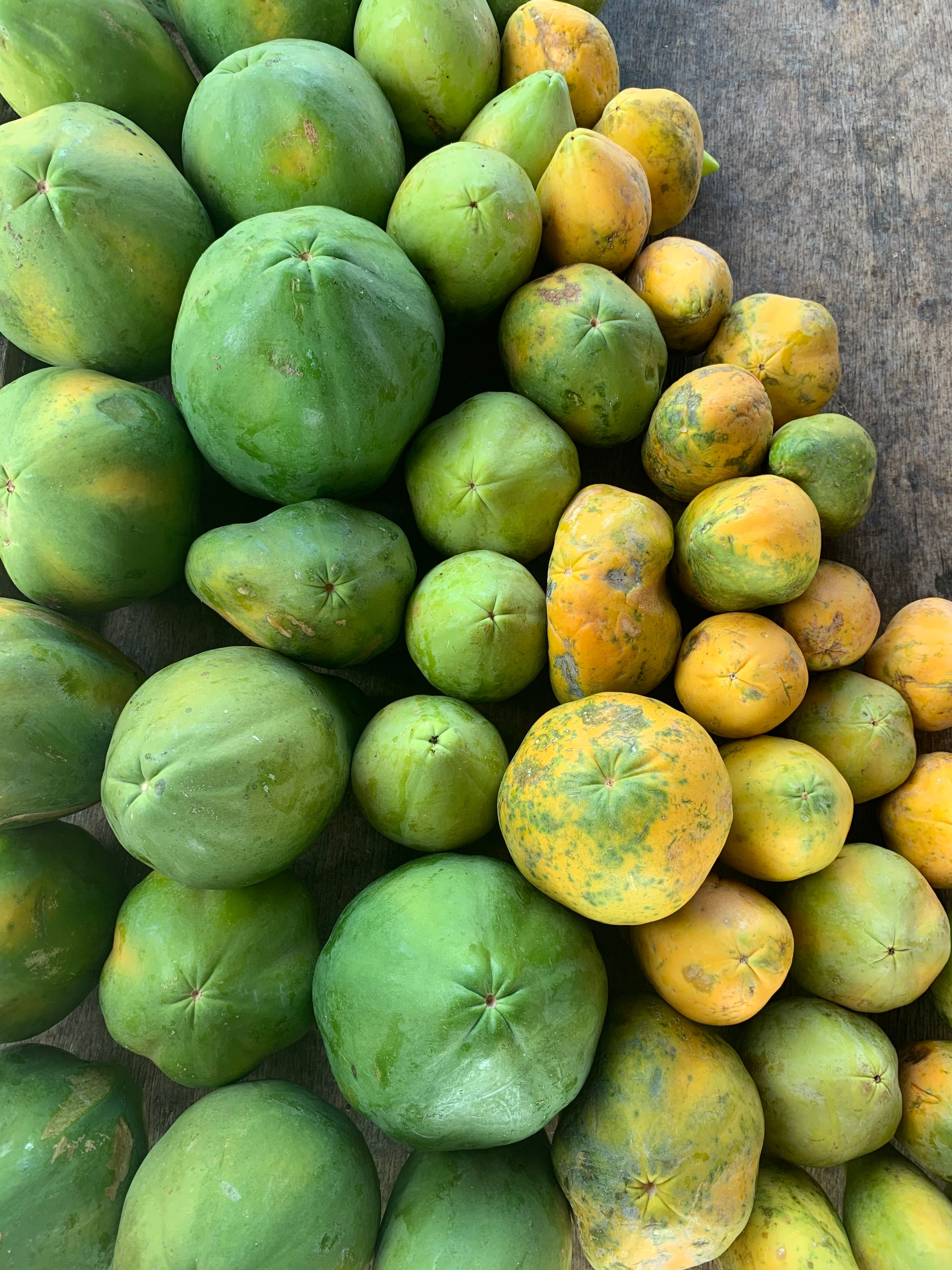 Fresh Papayas Displayed at a Market Stall · Free Stock Photo