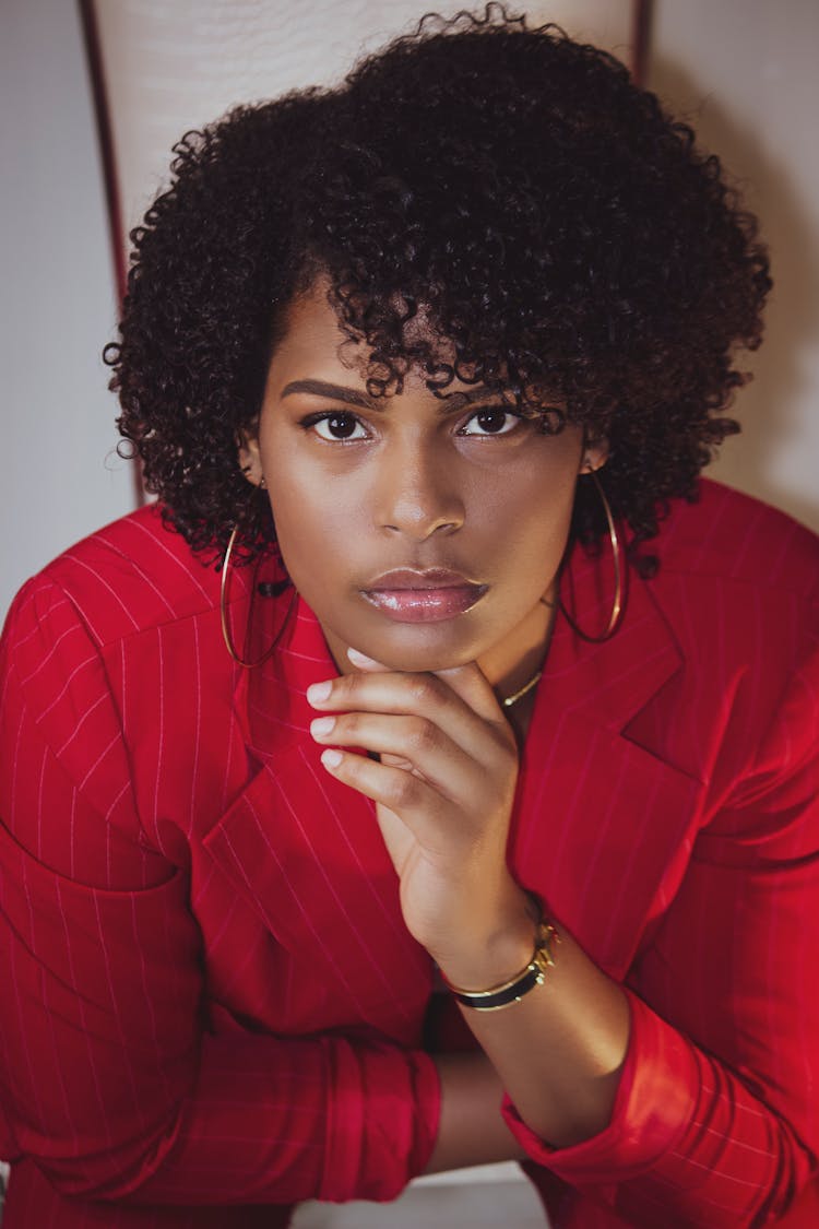 Photo Of Woman In Red Pinstripe Suit Posing 