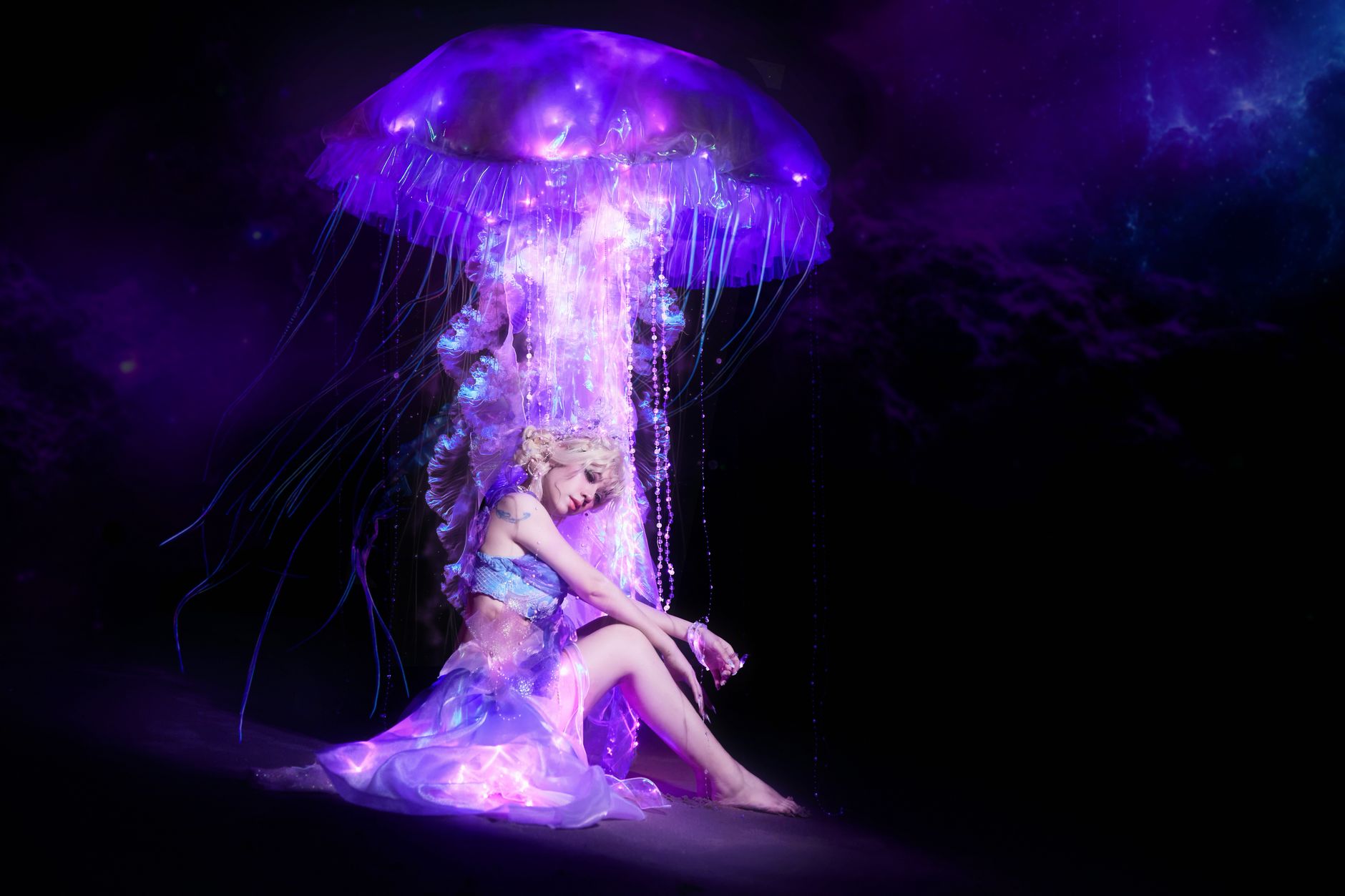 A surreal portrait of a person surrounded by a glowing, ethereal jellyfish in a cosmic setting.