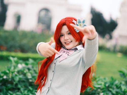 Free Colorful cosplay portrait of a woman outdoors in a lush Vietnamese garden. Stock Photo