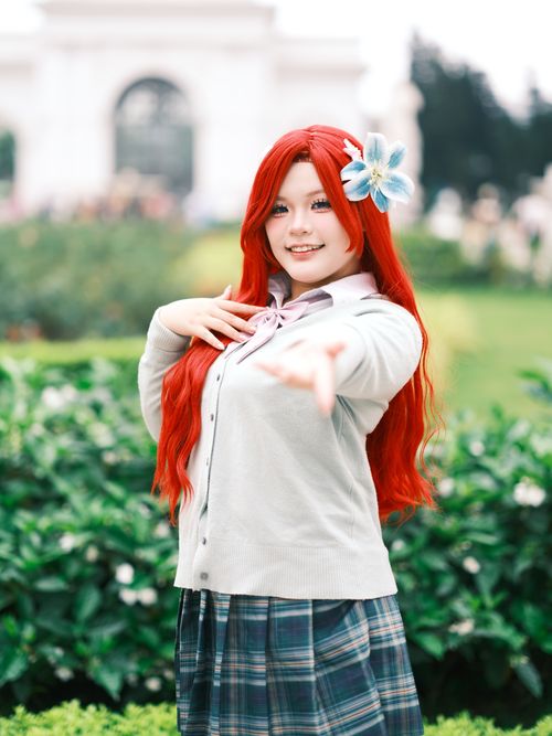 Free A colorful cosplay portrait set in a lush Vietnamese garden, showcasing creativity and vibrant fashion. Stock Photo