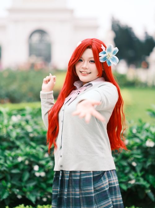 Free Colorful cosplay portrait of a young adult in a vibrant garden, showcasing creativity and culture. Stock Photo