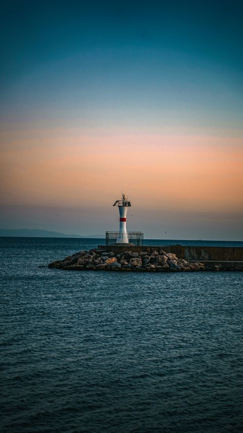 Free Tranquil view of a lighthouse during sunset in Istanbul, Turkey, with colorful skies. Stock Photo