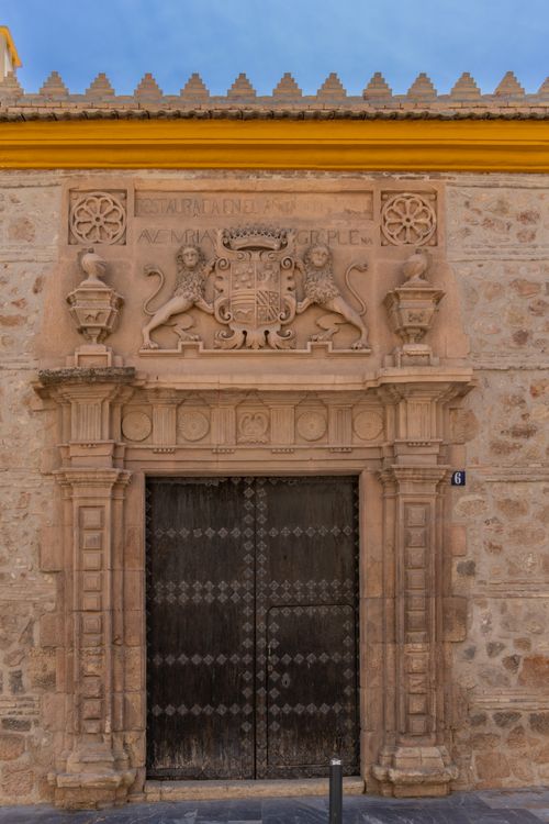 Free Intricately carved historic stone facade with a coat of arms in Lorca, Región de Murcia, Spain. Stock Photo