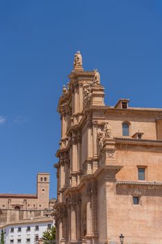 Beautiful Baroque facade in Lorca, Spain, under a clear blue sky showcasing detailed stonework.