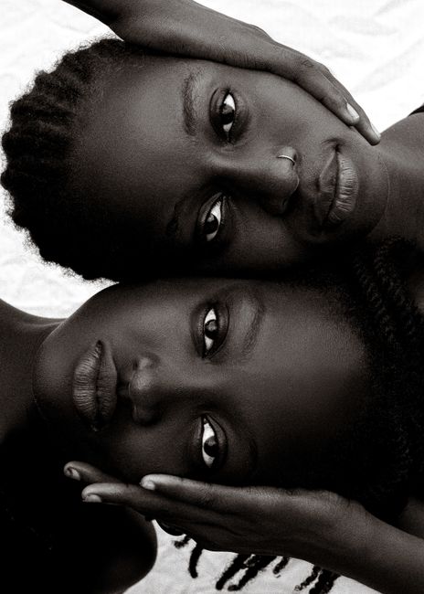 Black and white portrait of two women expressing deep emotion and connection.