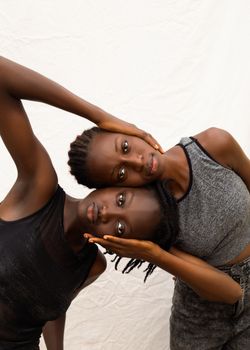 Artistic portrait of two women embracing, showcasing emotion and connection.