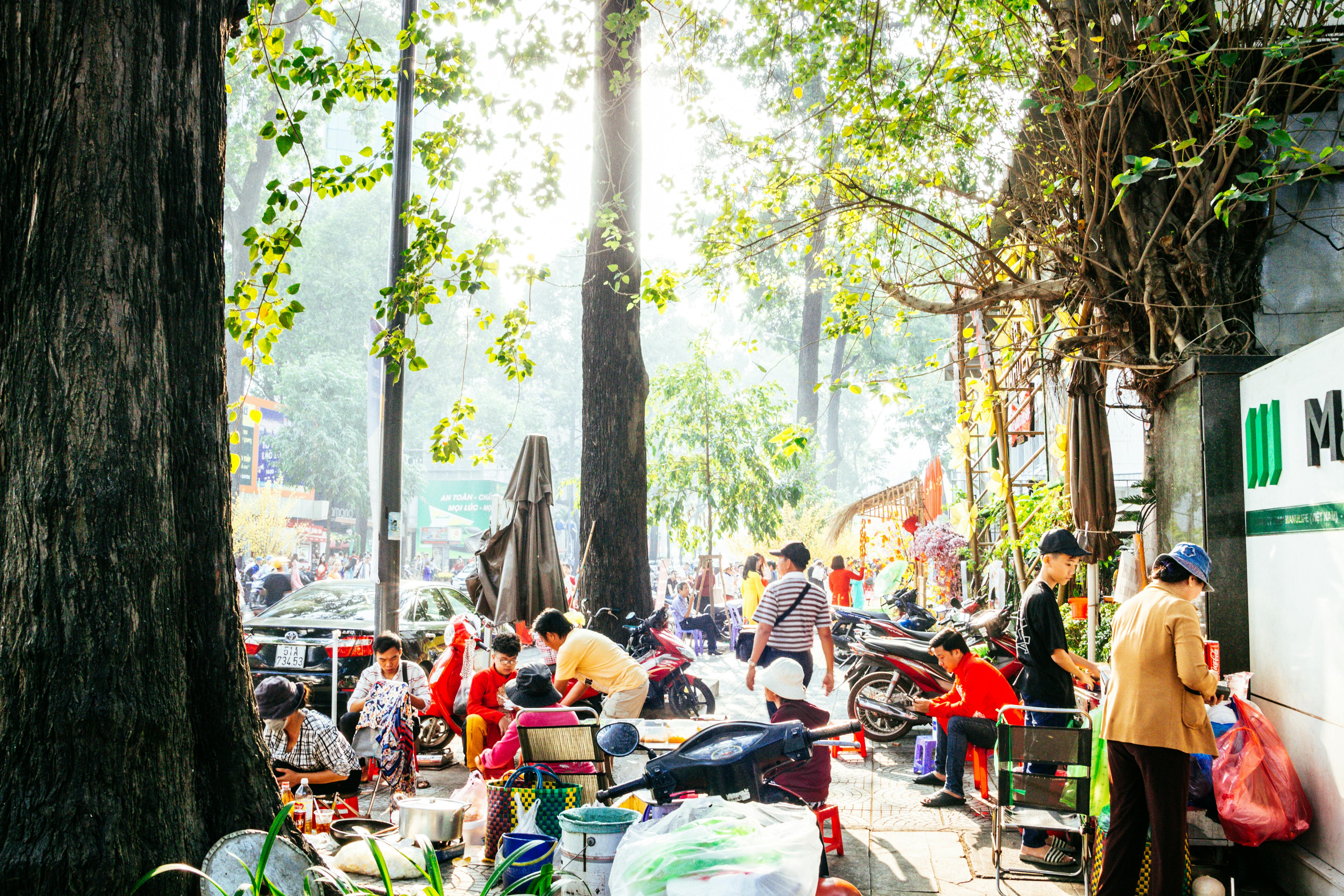 Vintage dolls and toys arranged on a shelf in warm nostalgic light