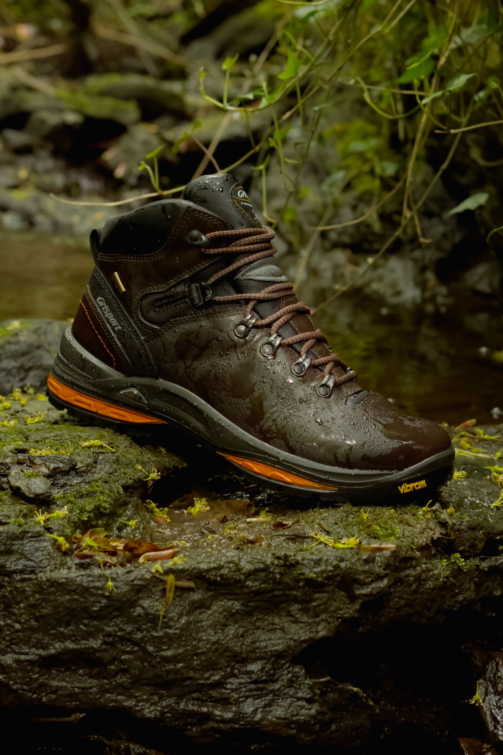 Waterproof hiking boot on wet terrain