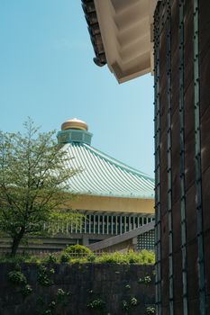 Architectural shot of the Tokyo National Museum and Sumo Arena showcasing unique roof design.