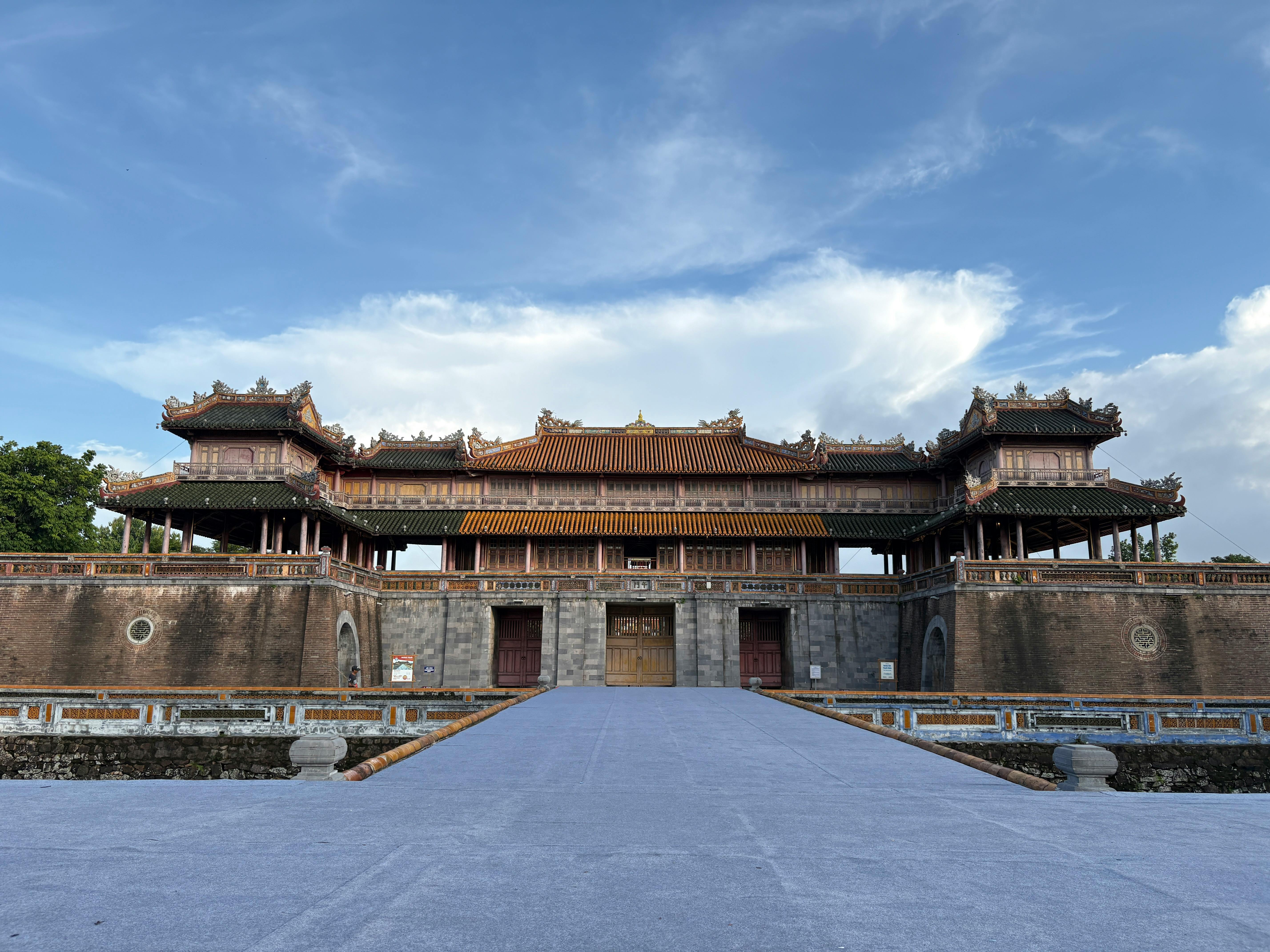 Front view of the historic Imperial City Gate in Hue with a clear blue sky.