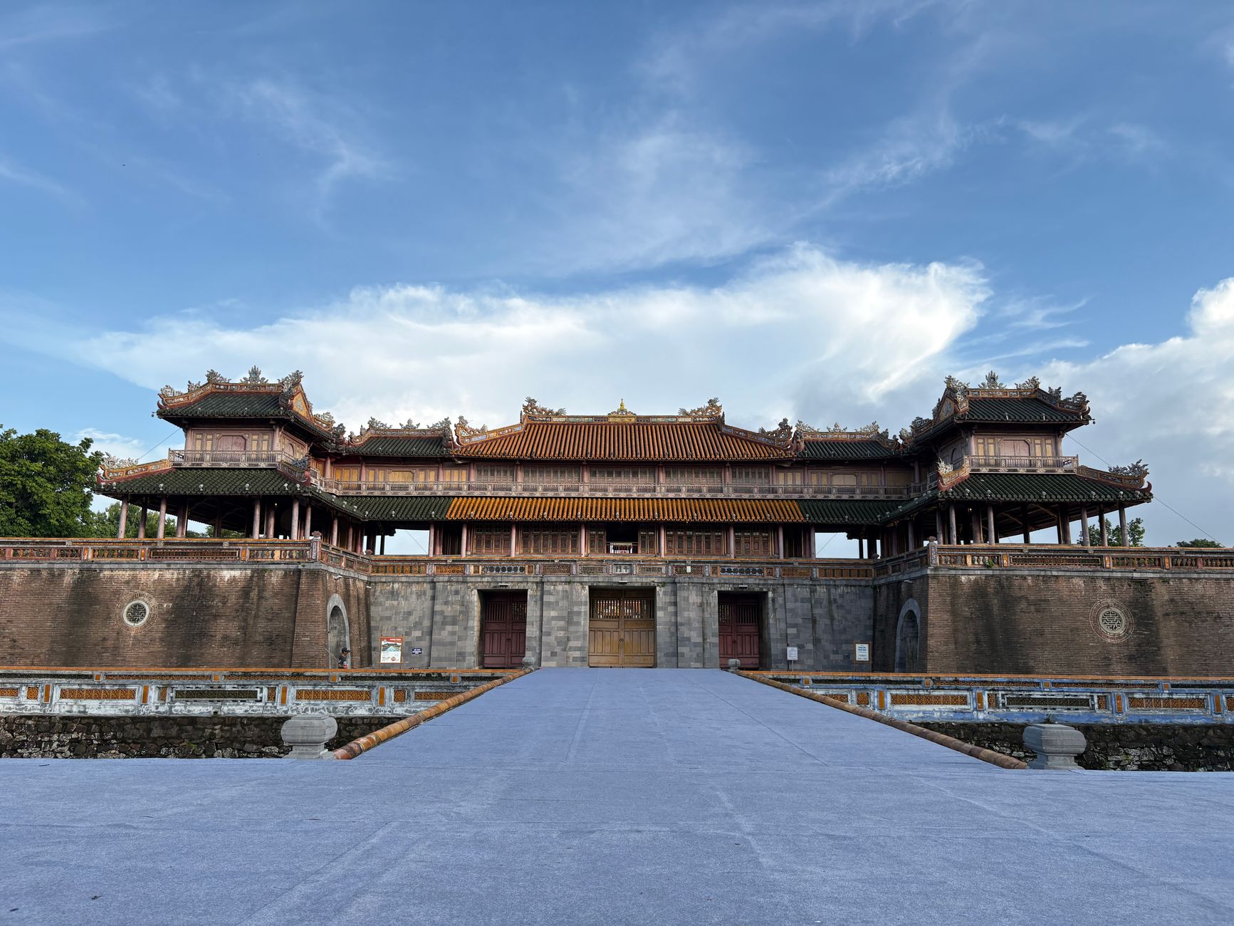 Front view of the historic Imperial City Gate in Hue with a clear blue sky.