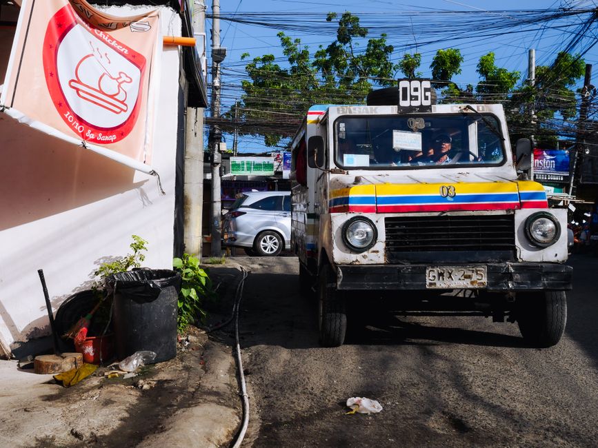 Tricycle parked on a street in a Philippine town