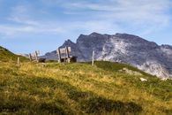 Beautiful mountain view in Graubünden, Switzerland with grasslands and rugged peaks.