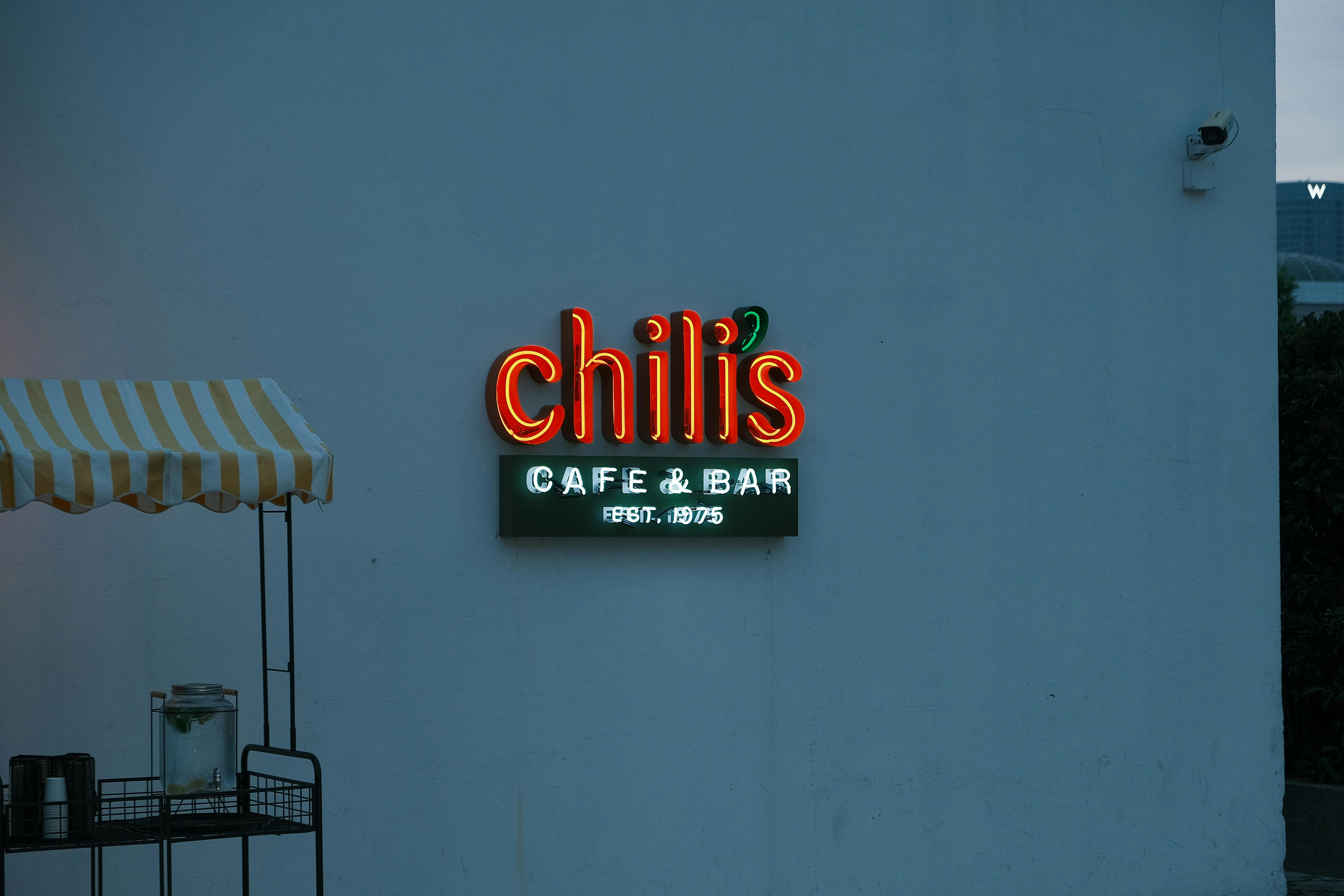 Sinsa-Apgujeong pocha tent-bar strip with neon storefronts