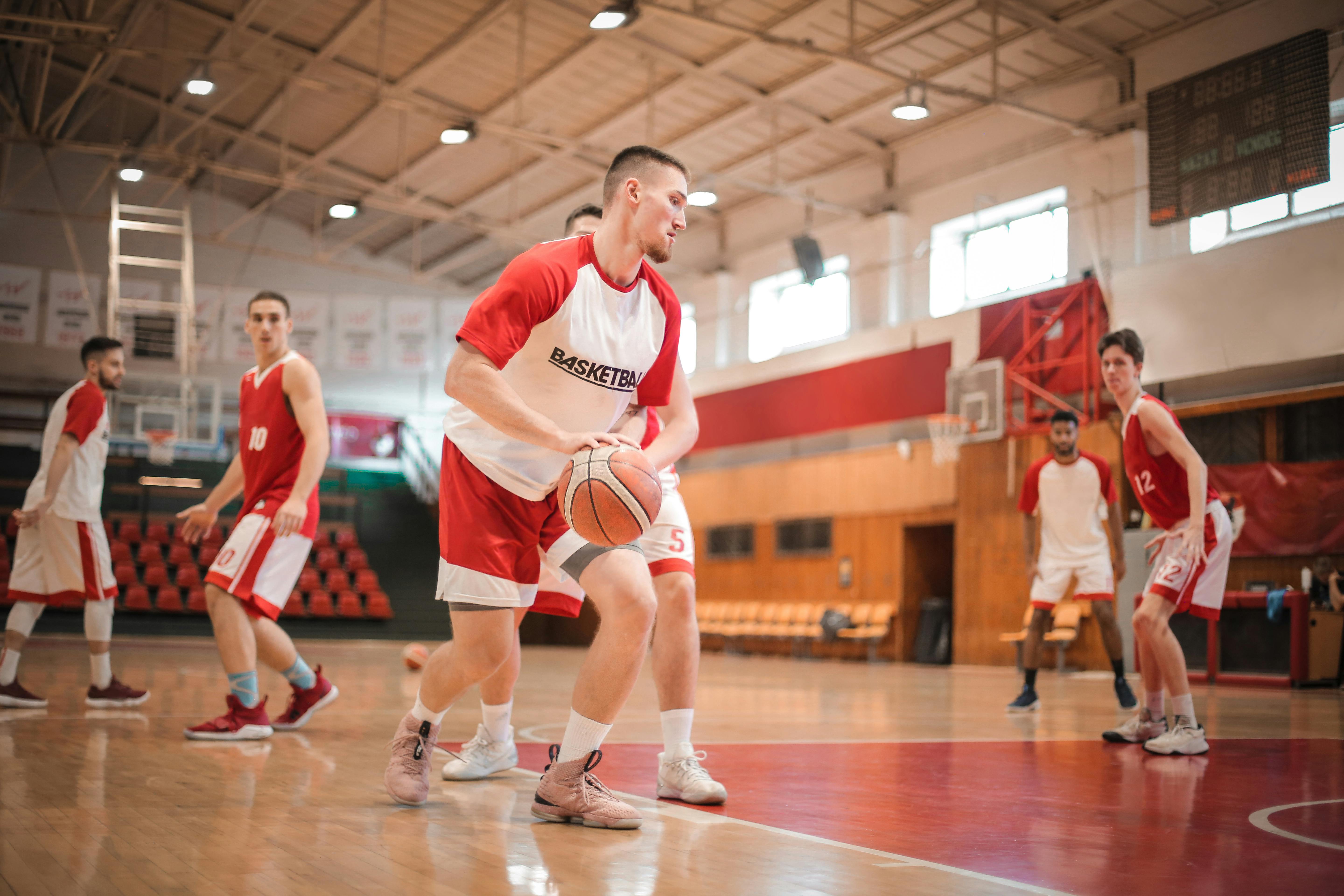 boys playing basketball in gym