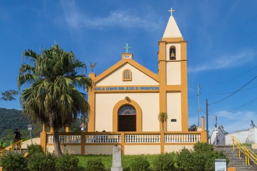 Front view of a historic church in Paranapiacaba with clear blue skies.