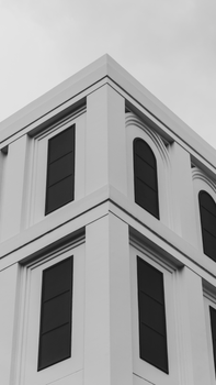Elegant minimalist black and white architectural building corner with windows.
