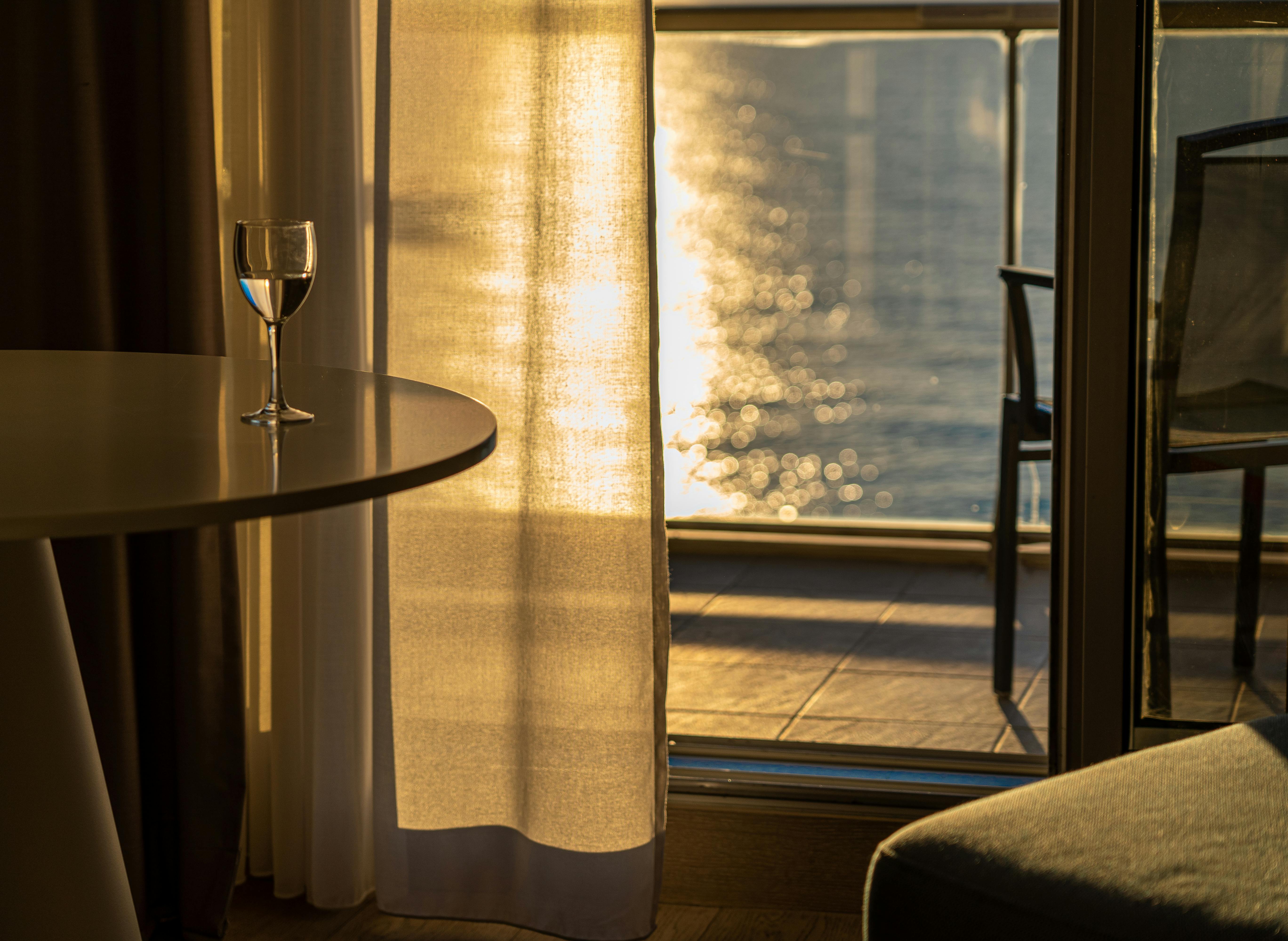 clear glass of water on table near window