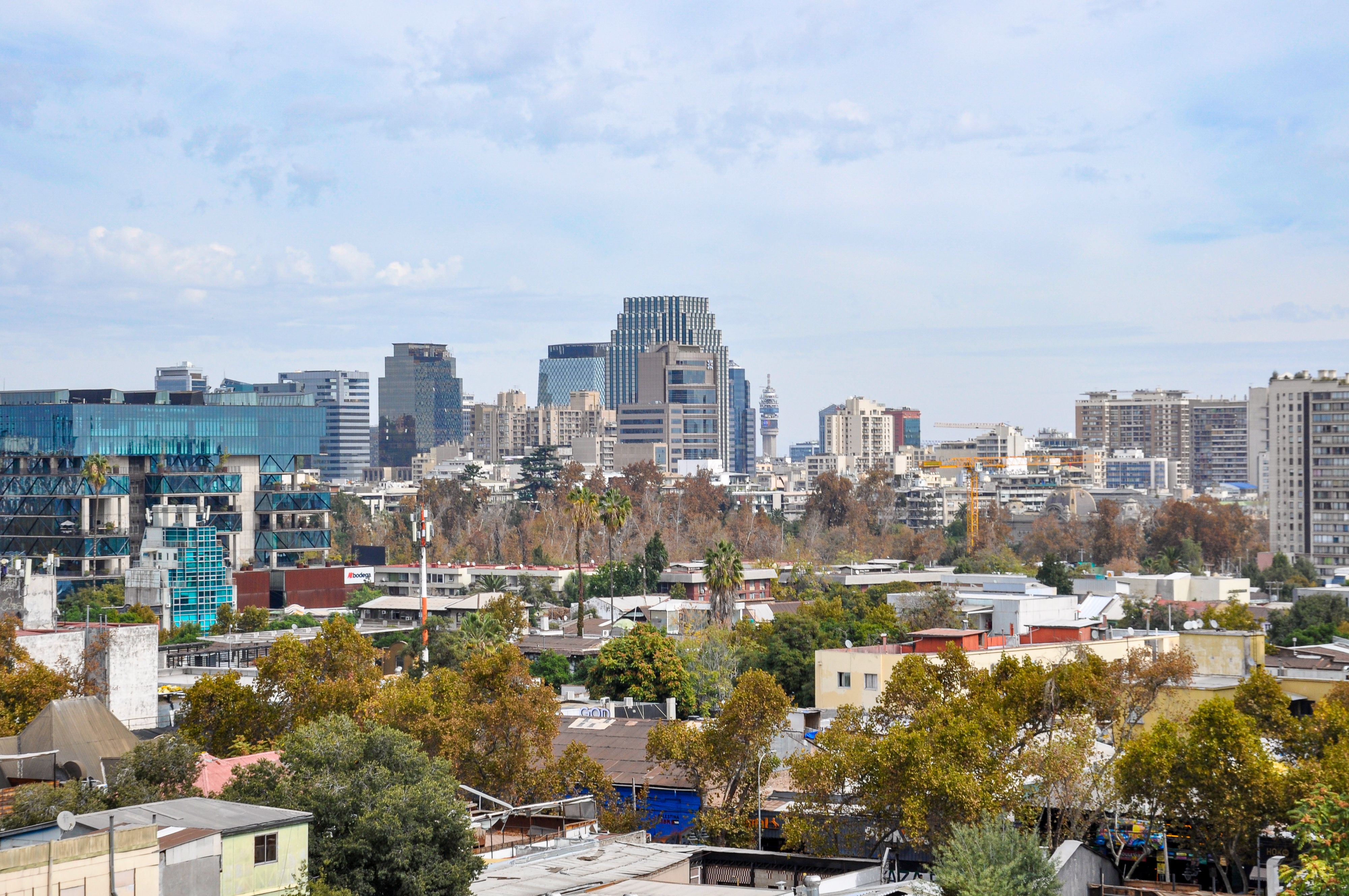 A vibrant cityscape of Santiago, Chile showcasing modern architecture against a clear sky.