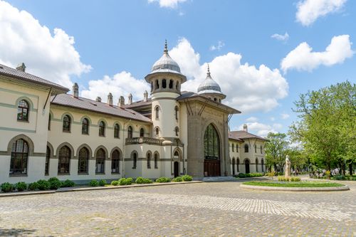 Free A beautiful historic building with domed architecture, set in a sunlit courtyard. Stock Photo