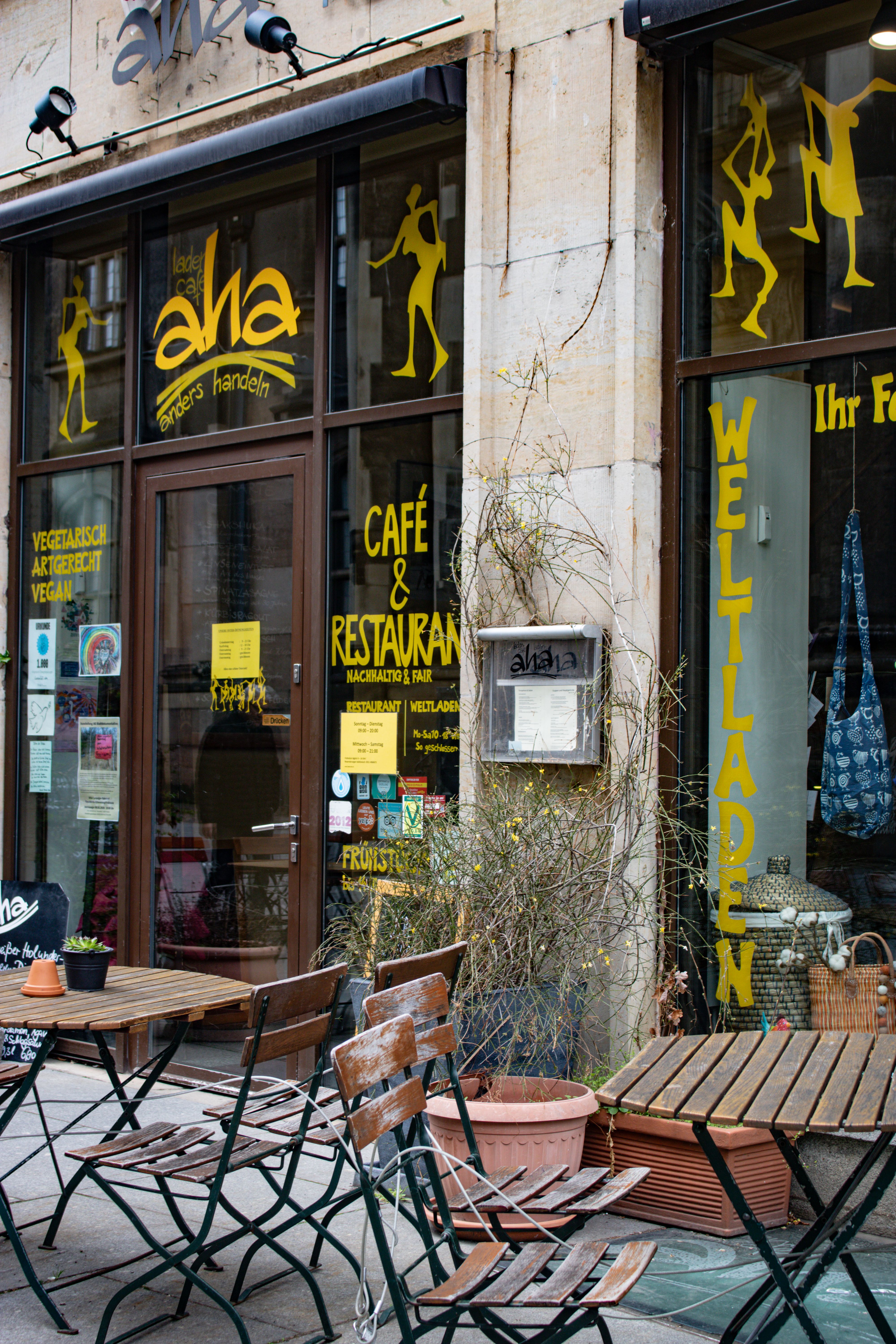 Charming outdoor seating at a vegan café in Dresden, offering a warm and inviting dining atmosphere.