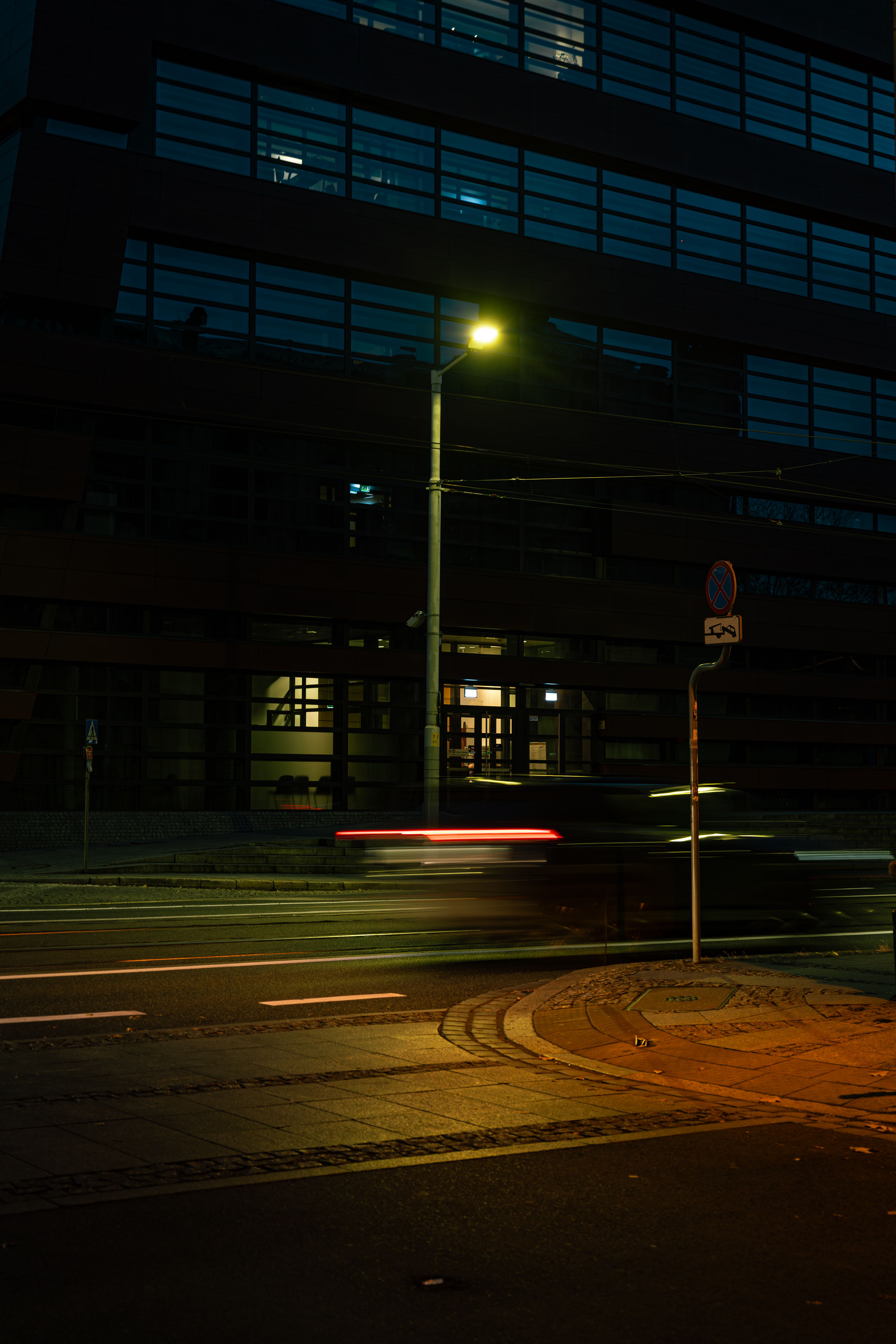 Night Street Scene with Blurred Car Lights · Free Stock Photo