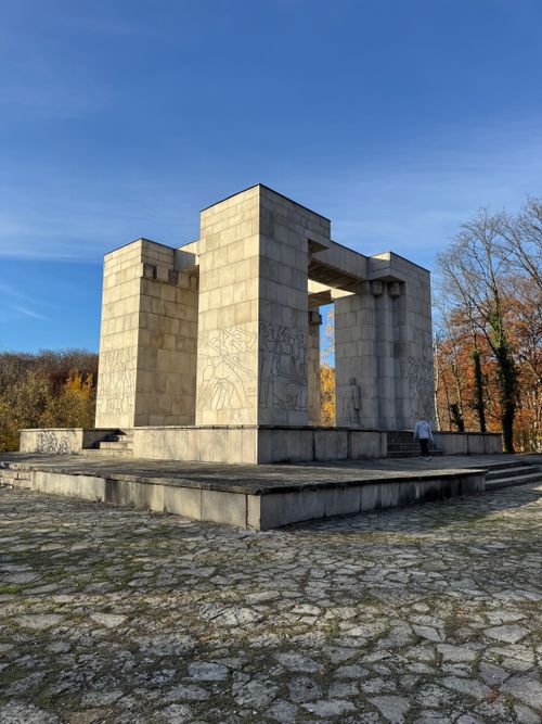 Free A striking stone monument under a clear blue sky in a tranquil park setting, offering ample copyspace. Stock Photo