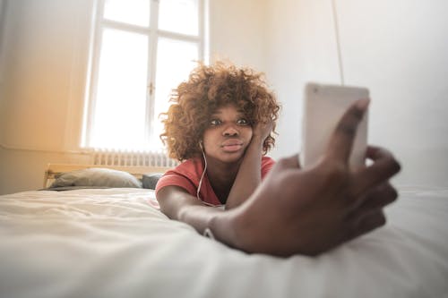 Free Curly Woman Taking A Selfie Stock Photo