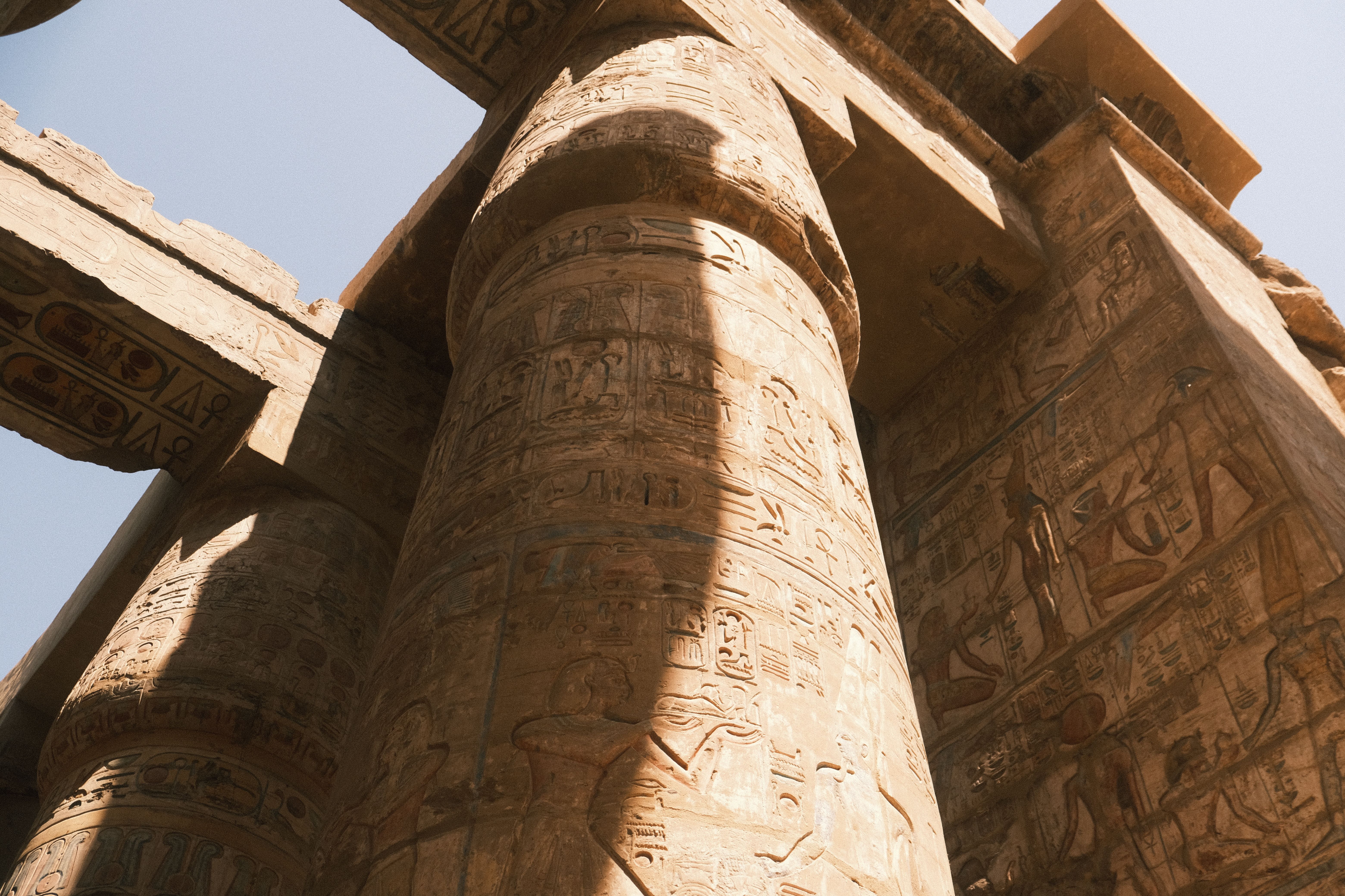 Sandstone columns at Karnak Temple with morning shadows