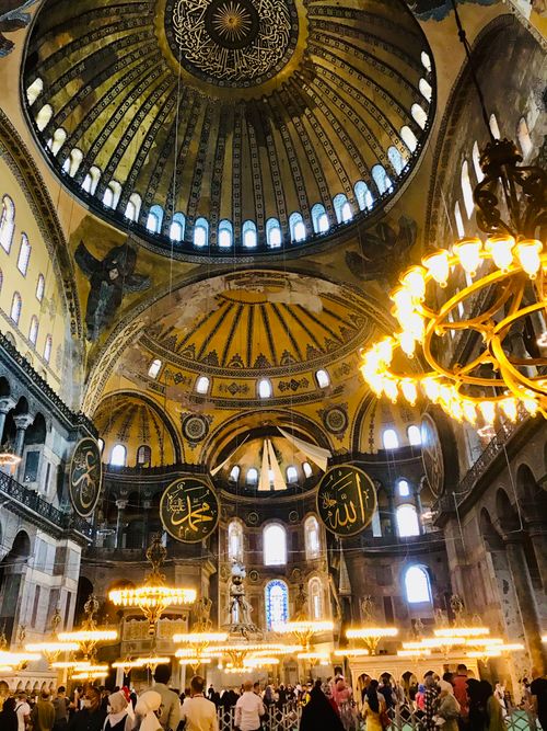 Free Magnificent view of Hagia Sophia's historic interior dome and ornate chandeliers in Istanbul. Stock Photo