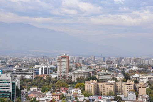 Free A panoramic view of Santiago, Chile highlighting its urban skyline against the Andes mountains. Stock Photo