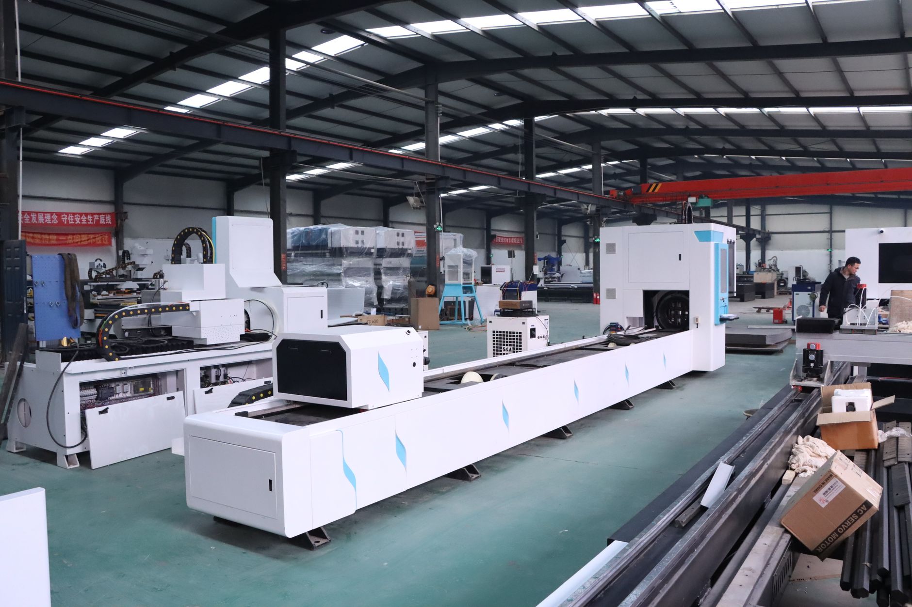 An industrial factory interior showcasing advanced CNC machines with no people in view.