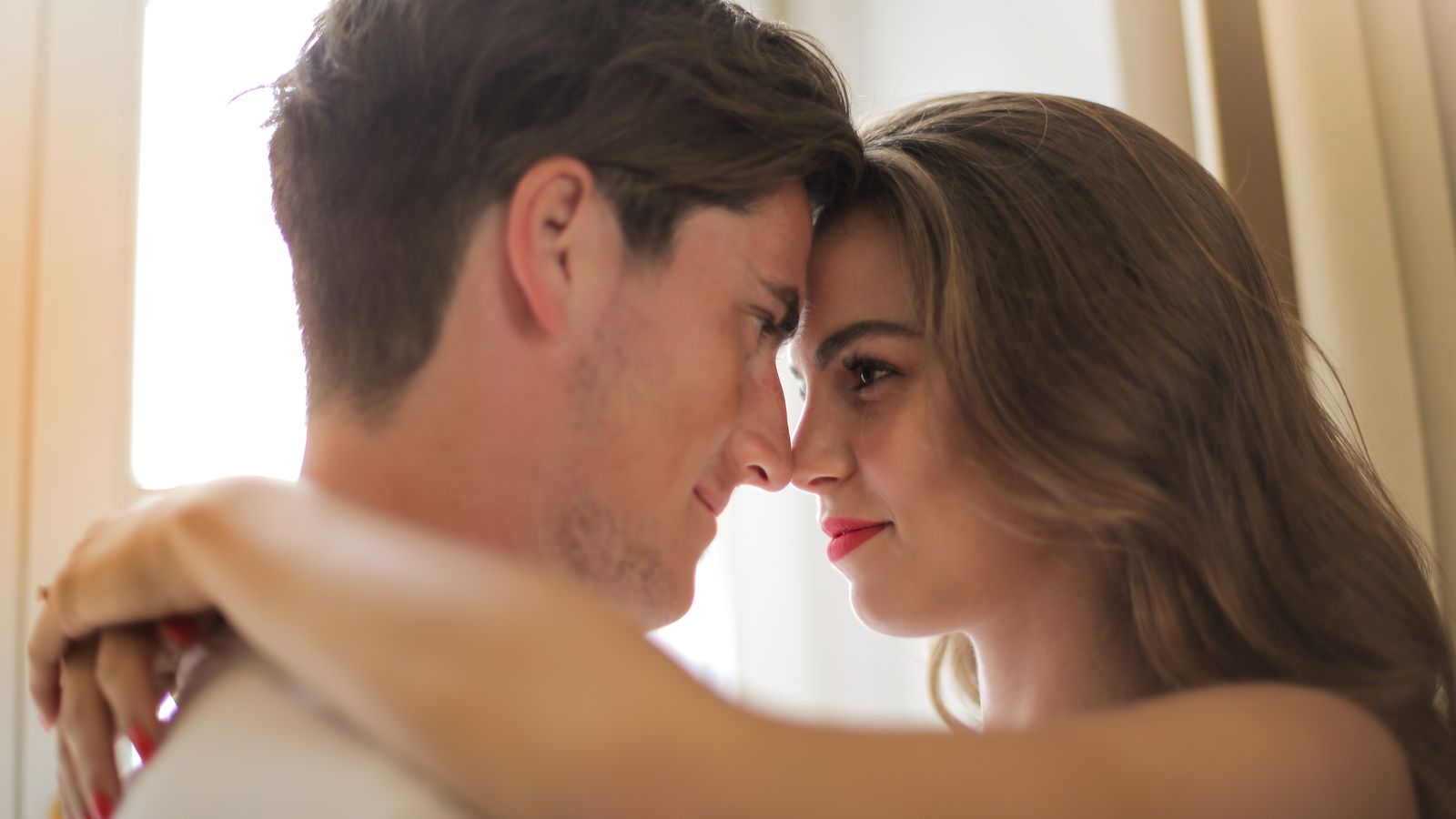 A couple sharing a tender, close moment