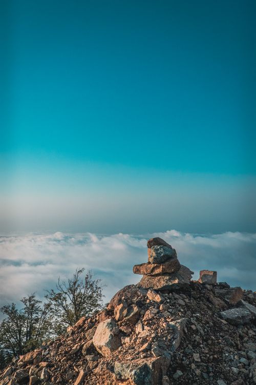 Free Breathtaking view from Gomi Mountain with rocks and clouds under a clear blue sky. Stock Photo