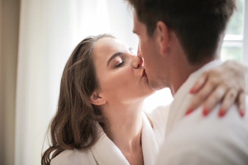 Free Man and Woman Kissing Each Other Stock Photo