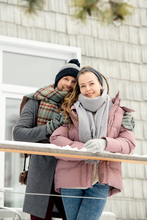 Man In Gray Coat Beside A Woman