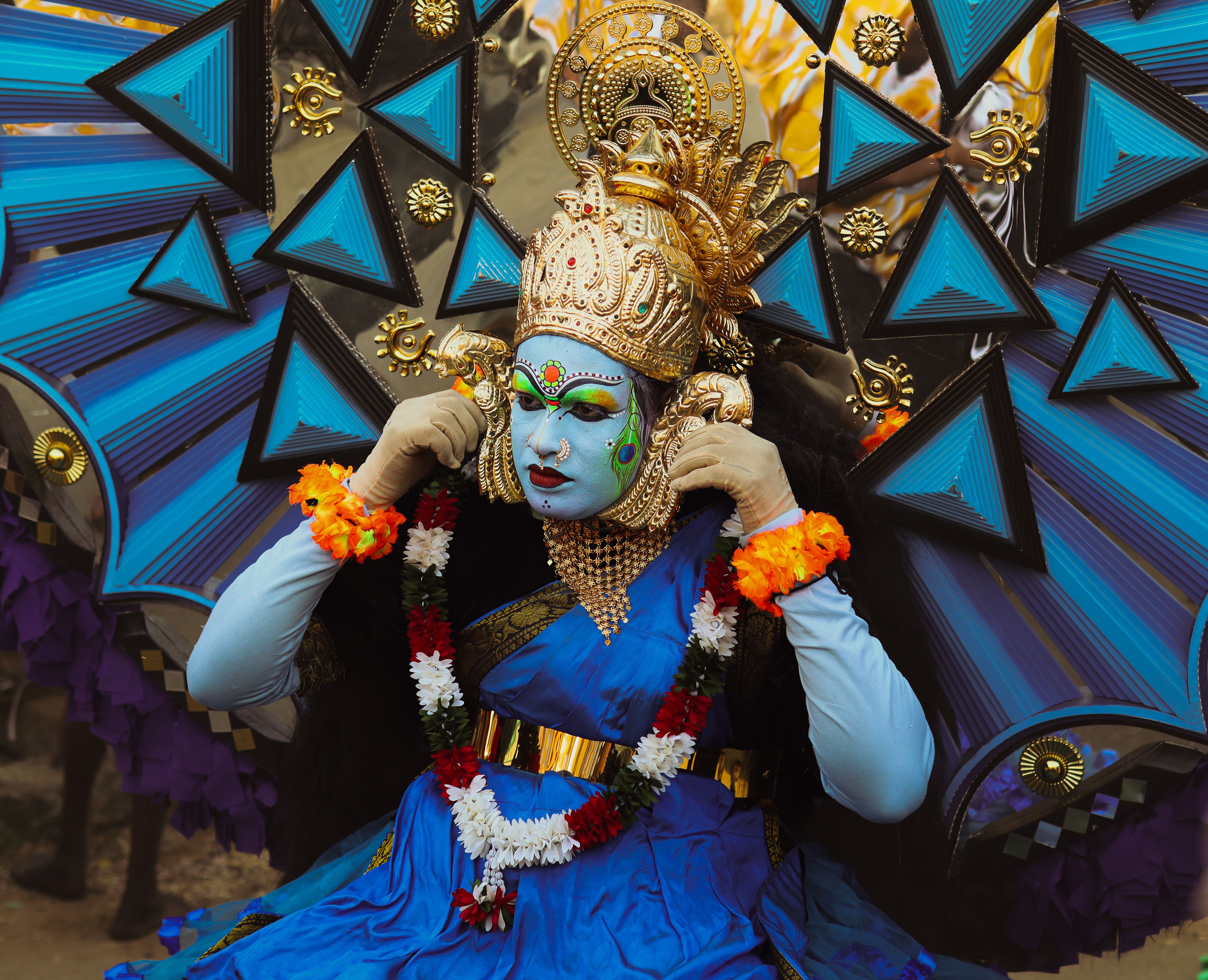 Colorful Kathakali dancer in traditional costume at Thrissur festival, Kerala, India.