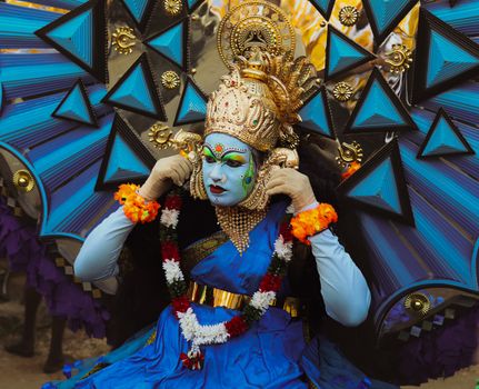 Colorful Kathakali dancer in traditional costume at Thrissur festival, Kerala, India.