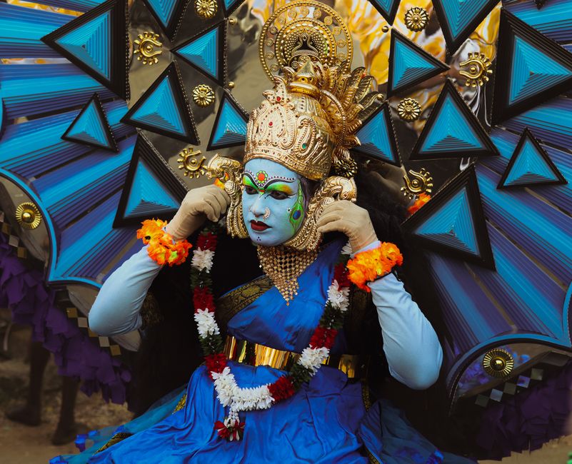 Colorful Kathakali dancer in traditional costume at Thrissur festival, Kerala, India.