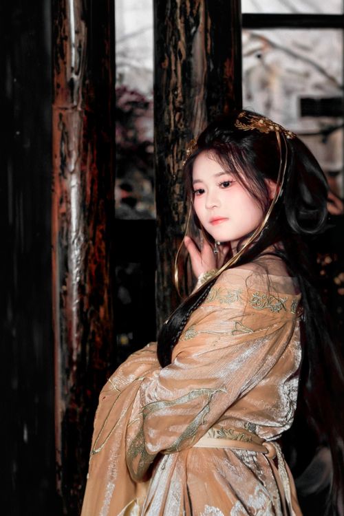 Free Woman in traditional historical dress, posing in a serene setting. Elegant and timeless. Stock Photo